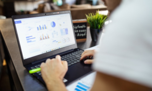 Man using his laptop to plan out his restaurant success