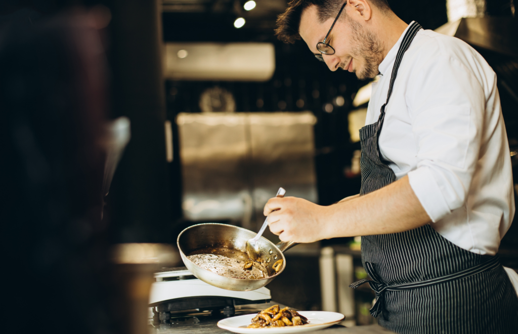 Chef Smiling After Looking Up How To Build A Restaurant Business Plan