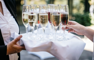 Quality service of champagne glasses - a typical result of high quality catering operations costs and menu planning