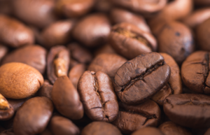 A close of up of raosted coffee beans, signifying that quality of product is key to cafe brand identity