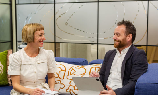 The Engine Room Hotel Consultants Having A Conversation On A Sofa